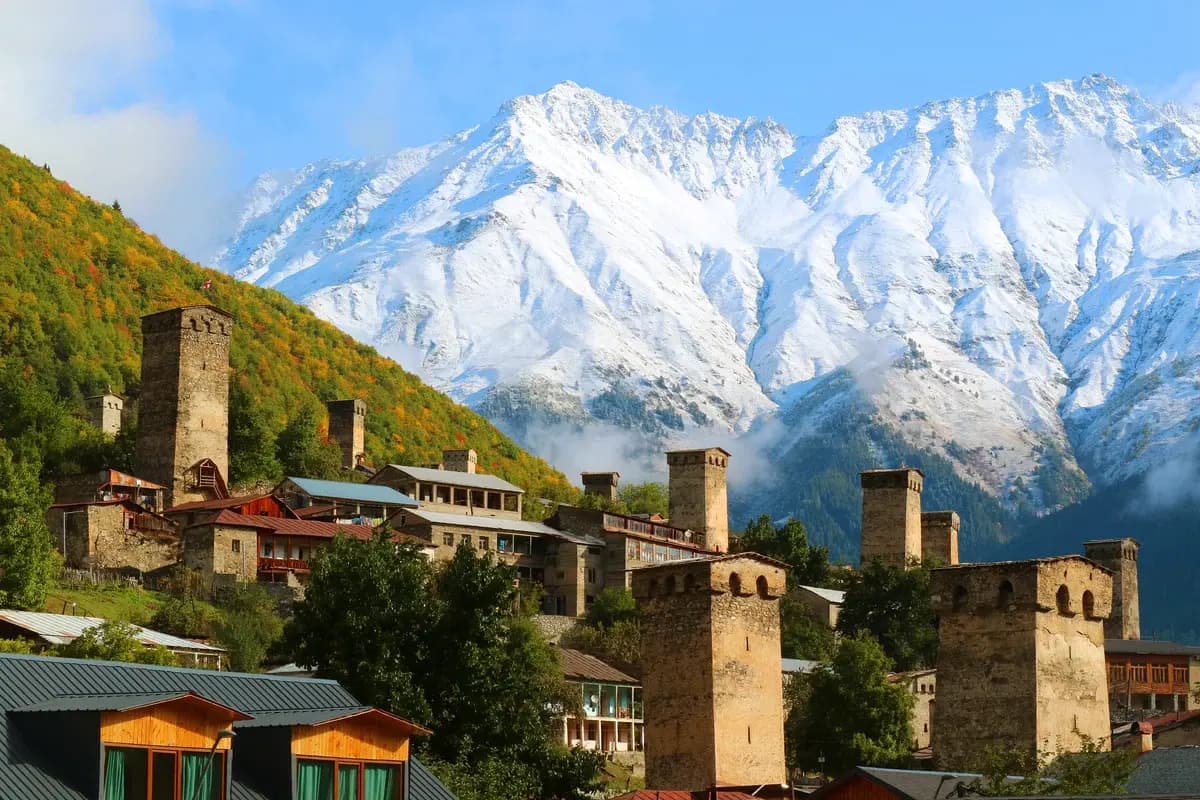Stunning medieval Svan towers against mountain backdrop