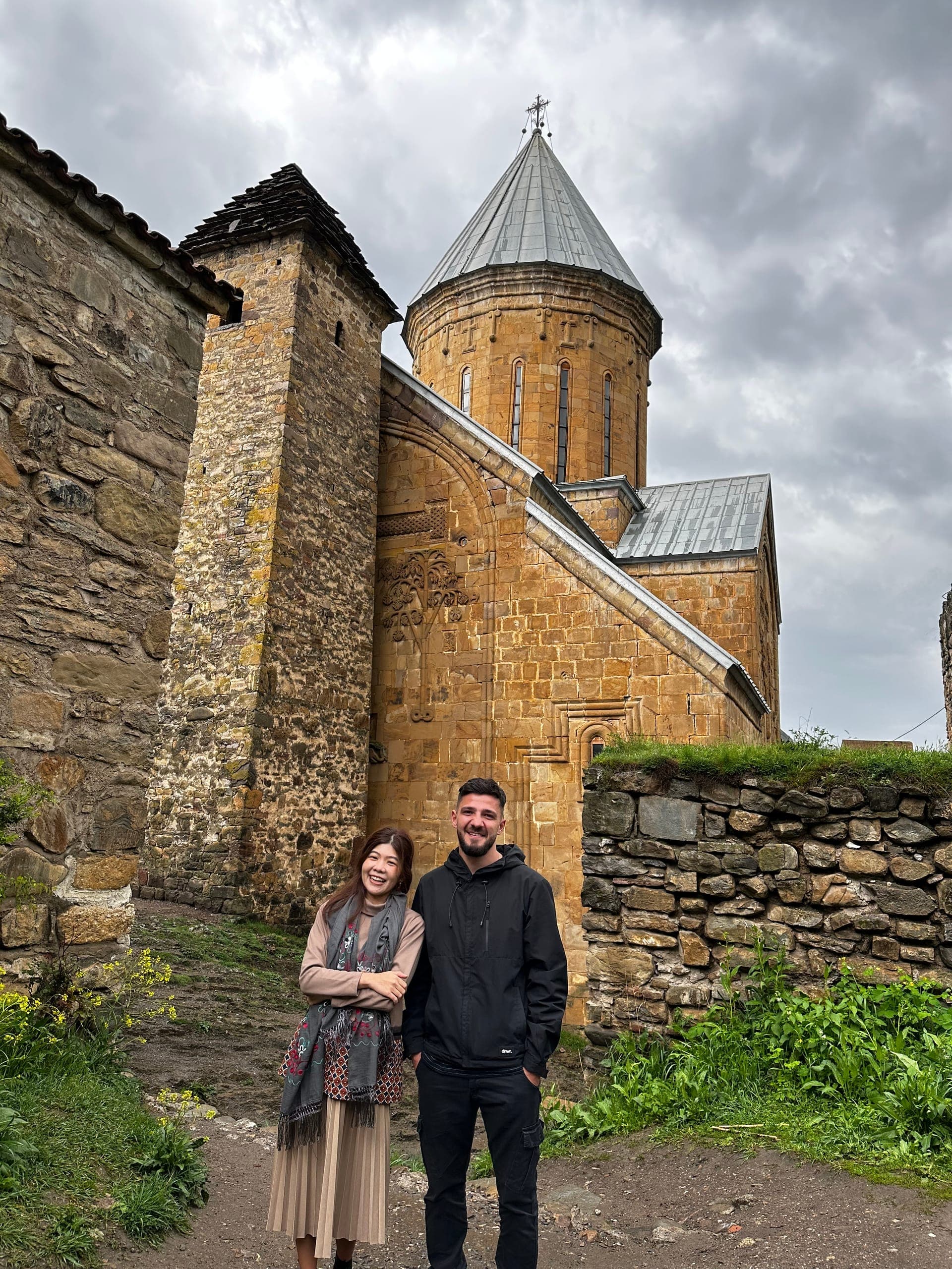 Mountain stream in Kazbegi with Caucasus peaks backdrop