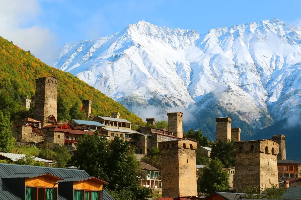 Stunning medieval Svan towers against mountain backdrop