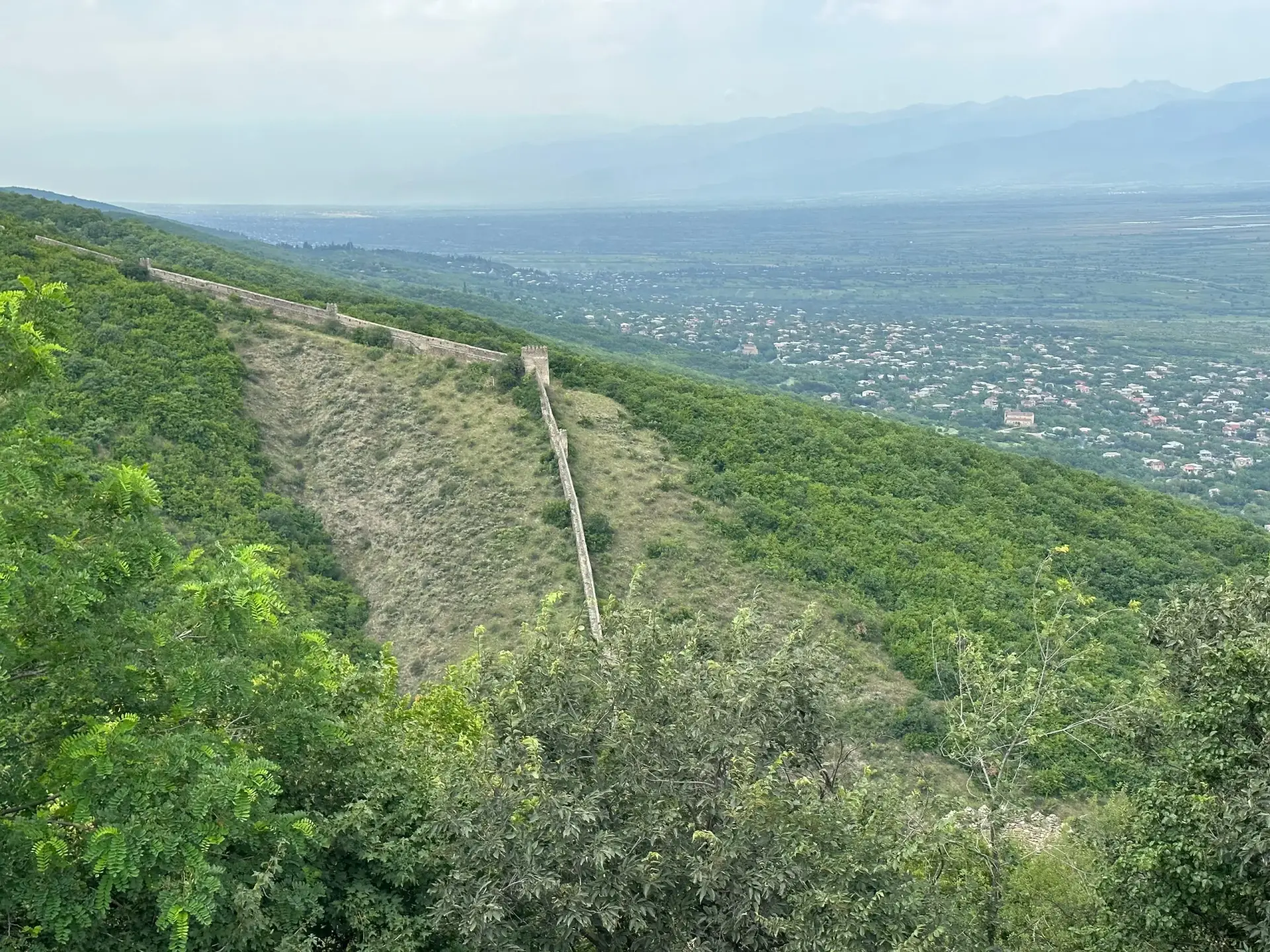 Historic Sighnaghi architecture with mountain backdrop